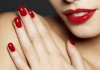 Photo of woman with fashion red nails and lips